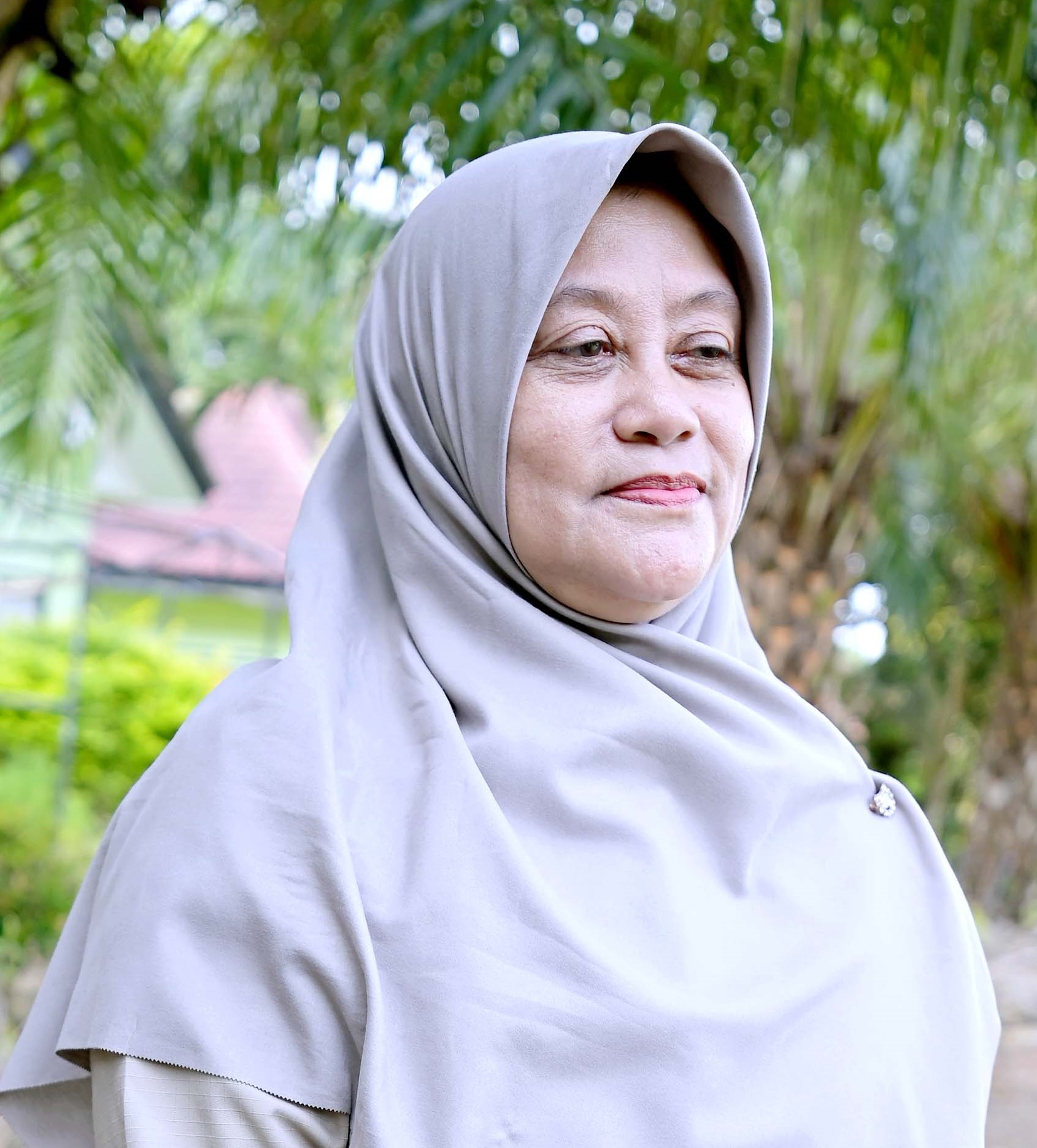 Dra. RIFQIYATI